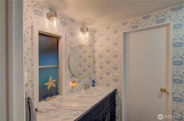 1411 297th Ln, Ocean Park, WA 98640 - bathroom featuring wallpapered walls and vanity