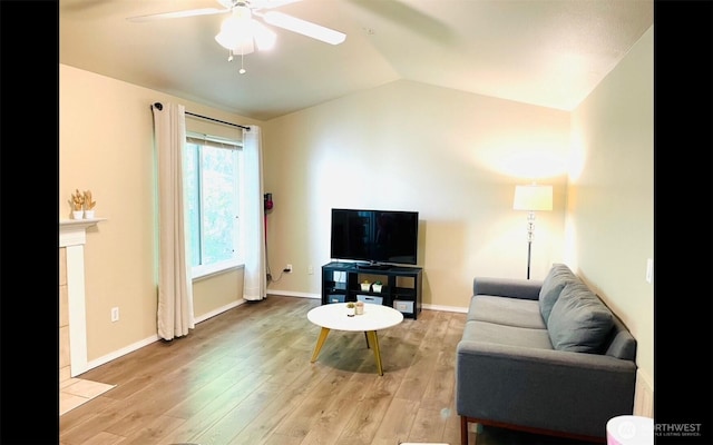 1009 112th St Unit D304, Everett, WA 98208 - living room featuring ceiling fan, vaulted ceiling, and light wood-style floors