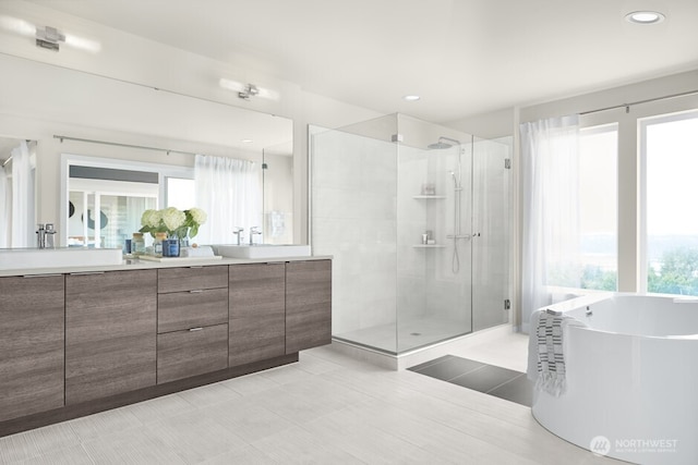 19644 136th Ln SE, Monroe, WA 98272 - bathroom featuring double vanity, a stall shower, a freestanding tub, healthy amount of natural light, and recessed lighting