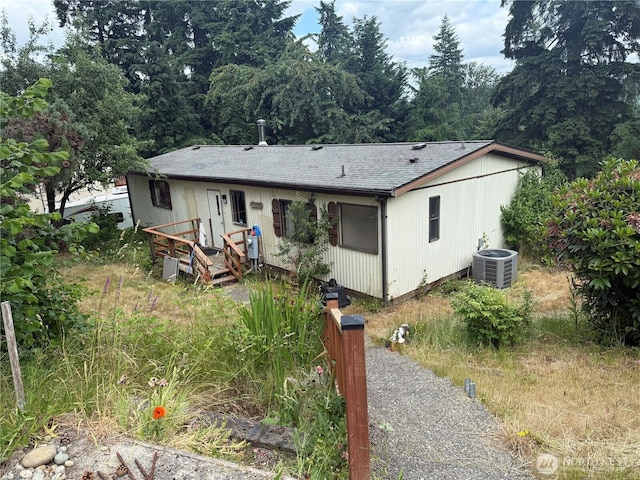 14307 215th Ave E, Bonney Lake, WA 98391 - view of front facade featuring roof with shingles and a deck