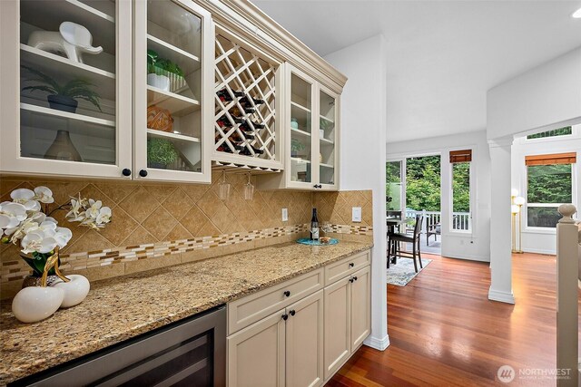 1402 180th Ave E, Lake Tapps, WA 98391 - indoor dry bar with dark wood finished floors, backsplash, and beverage cooler