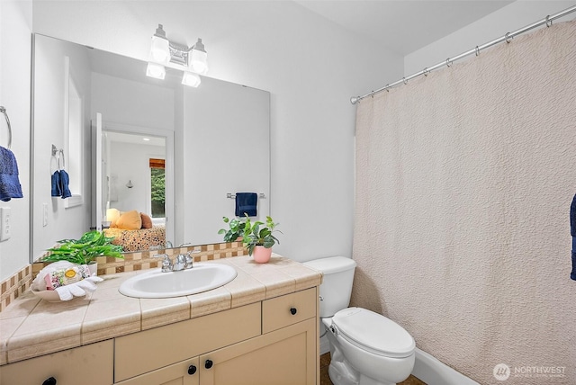 1402 180th Ave E, Lake Tapps, WA 98391 - bathroom featuring vanity and tasteful backsplash