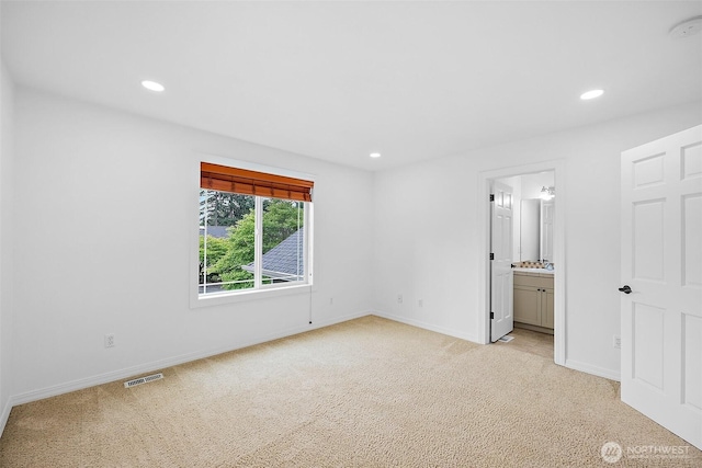 1402 180th Ave E, Lake Tapps, WA 98391 - unfurnished bedroom with light colored carpet, recessed lighting, and ensuite bath
