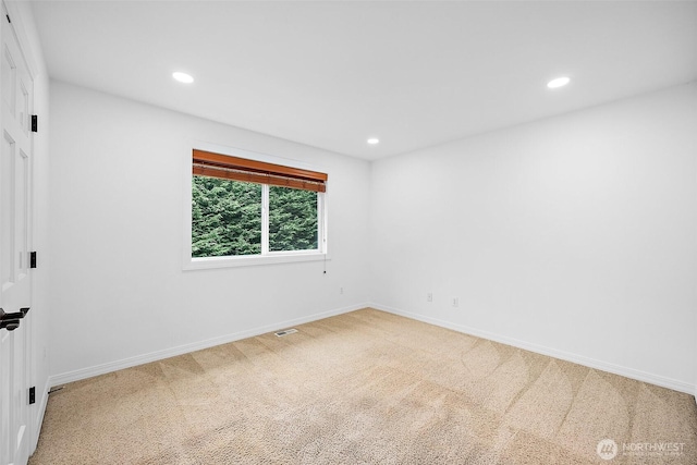 1402 180th Ave E, Lake Tapps, WA 98391 - spare room featuring recessed lighting and carpet flooring