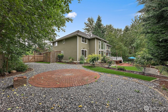 1402 180th Ave E, Lake Tapps, WA 98391 - back of house with a patio area and a wooden deck