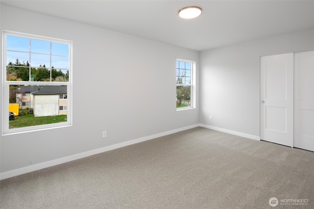 544 SW 97th St Unit 5, Seattle, WA 98106 - carpeted spare room featuring baseboards