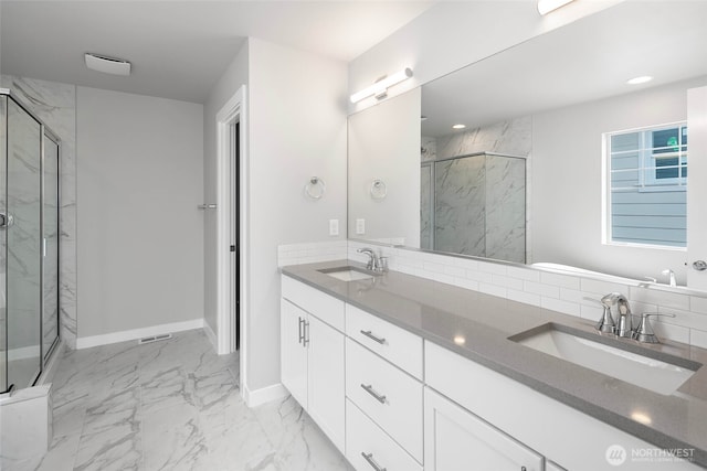 544 SW 97th St Unit 5, Seattle, WA 98106 - bathroom with a marble finish shower, double vanity, marble finish floors, and recessed lighting