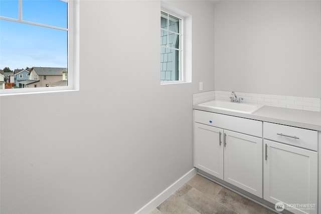 544 SW 97th St Unit 5, Seattle, WA 98106 - bathroom with baseboards and vanity