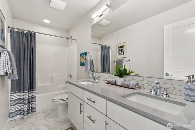 9898 5th Ln SW Unit 23, Seattle, WA 98106 - bathroom featuring marble finish floors, shower / bath combo, double vanity, recessed lighting, and backsplash