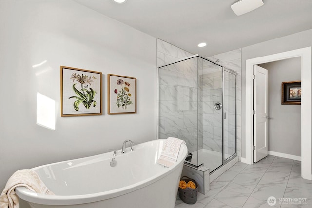 9898 5th Ln SW Unit 23, Seattle, WA 98106 - bathroom featuring marble look tile flooring, a freestanding tub, a shower stall, and recessed lighting