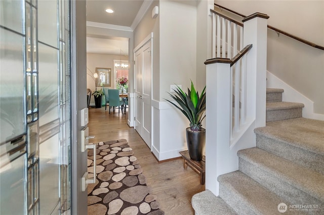 24220 93rd Ct S, Kent, WA 98030 - foyer featuring wood finished floors, stairs, ornamental molding, a chandelier, and recessed lighting