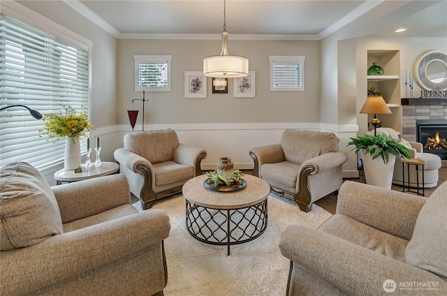 24220 93rd Ct S, Kent, WA 98030 - living area with crown molding, plenty of natural light, a tile fireplace, and built in shelves