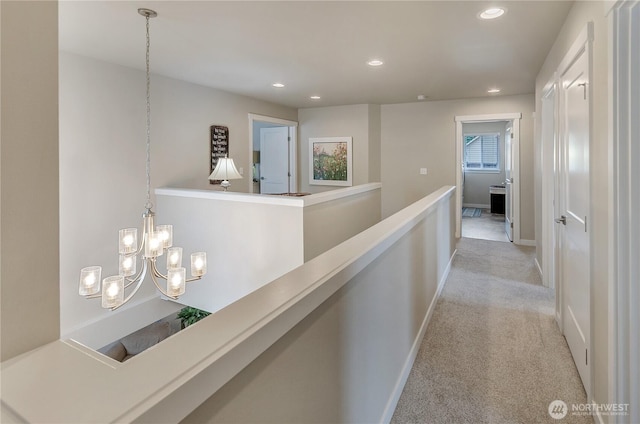 24220 93rd Ct S, Kent, WA 98030 - hallway featuring light carpet, recessed lighting, a chandelier, and an upstairs landing