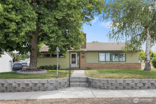 308 2nd Ave, Harrington, WA 99134 - ranch-style home featuring a front lawn and a chimney