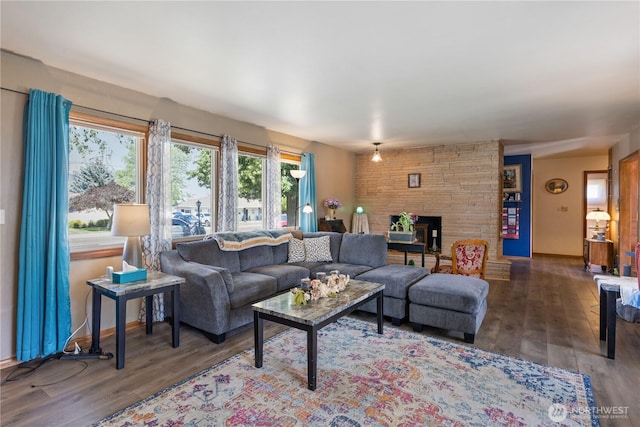 308 2nd Ave, Harrington, WA 99134 - living area featuring a stone fireplace and wood finished floors