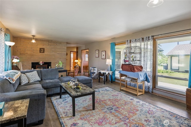 308 2nd Ave, Harrington, WA 99134 - living room featuring a stone fireplace and wood finished floors