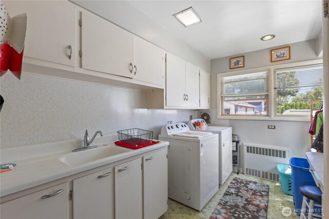 308 2nd Ave, Harrington, WA 99134 - laundry room with radiator, independent washer and dryer, and cabinet space