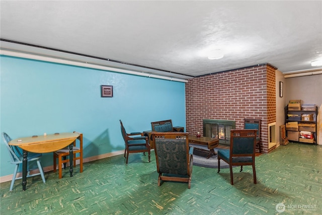 308 2nd Ave, Harrington, WA 99134 - sitting room featuring a brick fireplace and baseboards