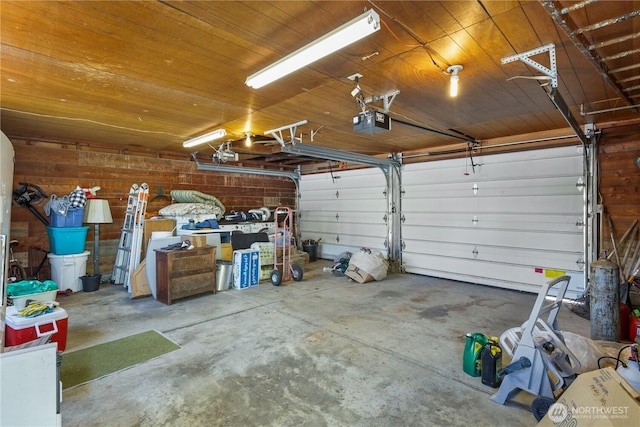 308 2nd Ave, Harrington, WA 99134 - garage with a garage door opener and wood ceiling
