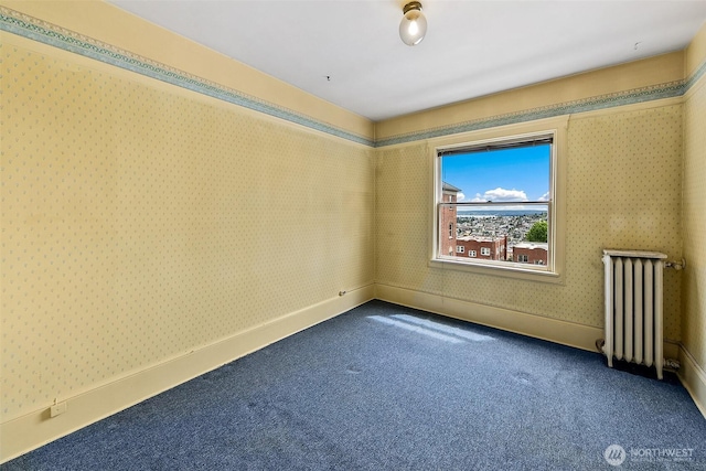 1902 Bigelow Ave N Unit 301, Seattle, WA 98109 - empty room with radiator heating unit, dark colored carpet, and wallpapered walls
