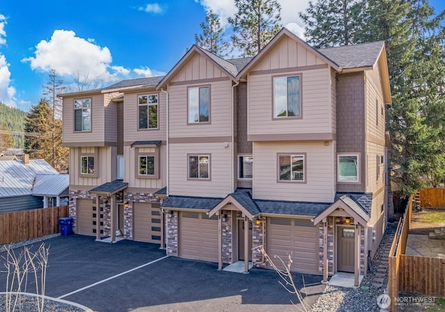 121 Stafford St, Leavenworth, WA 98826 - multi unit property with stone siding, an attached garage, board and batten siding, and driveway