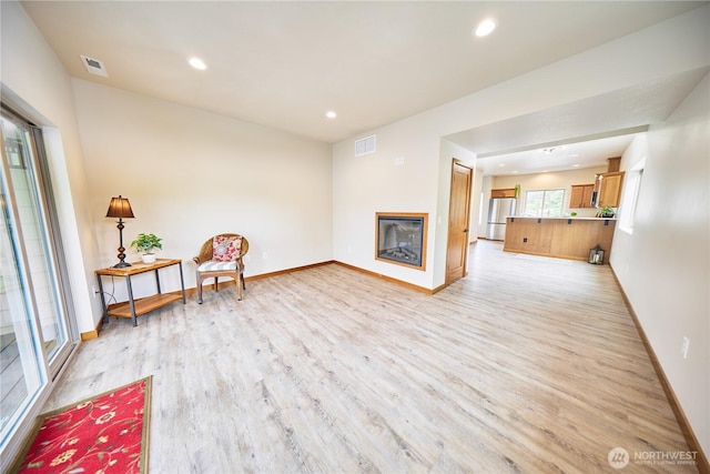 121 Stafford St, Leavenworth, WA 98826 - sitting room with light wood-style flooring, a glass covered fireplace, and recessed lighting
