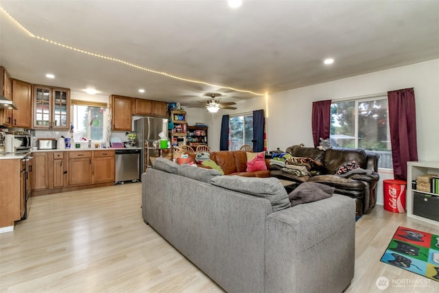 8715 Whitewood Loop SE, Yelm, WA 98597 - living area with light wood-style floors, a ceiling fan, and recessed lighting