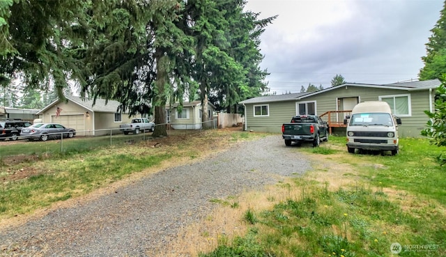 8715 Whitewood Loop SE, Yelm, WA 98597 - view of front of property with gravel driveway