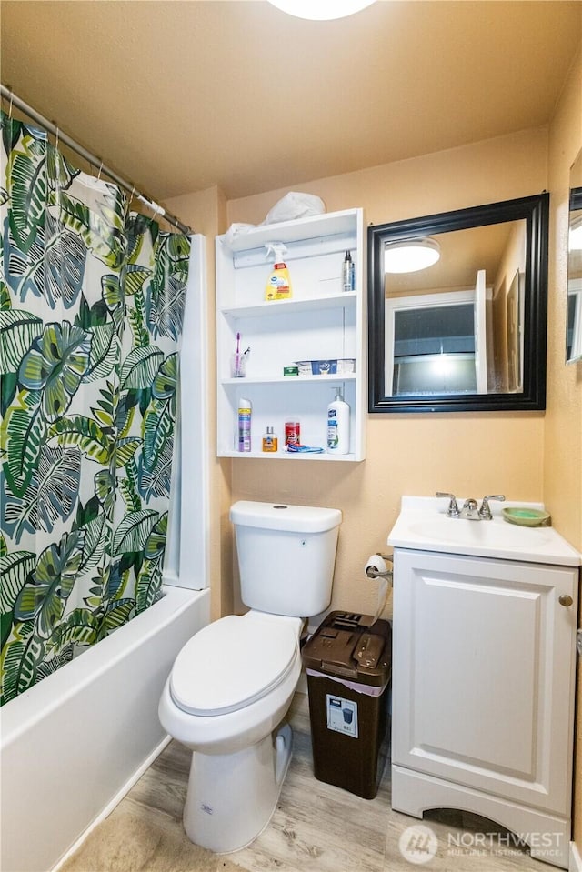 1107 S 4th St, Dayton, WA 99328 - full bath featuring vanity, shower / bath combo with shower curtain, and wood finished floors