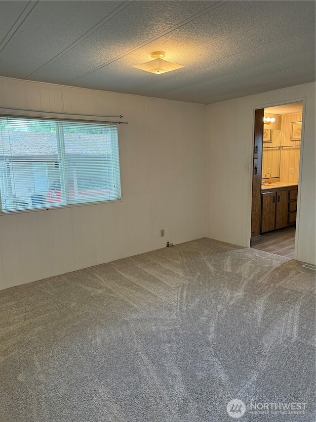 2308 Ventura Ave, Enumclaw, WA 98022 - spare room with carpet floors and a textured ceiling