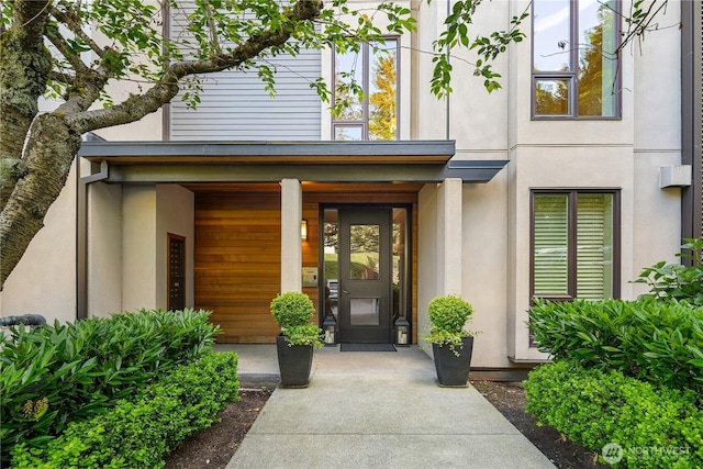 101 101st Ave SE Unit 201A, Bellevue, WA 98004 - property entrance with stucco siding and covered porch