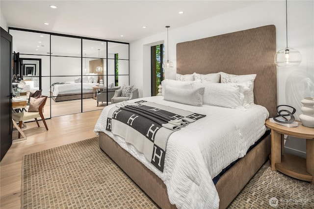 101 101st Ave SE Unit 201A, Bellevue, WA 98004 - bedroom featuring wood finished floors and recessed lighting