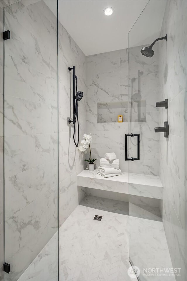 101 101st Ave SE Unit 201A, Bellevue, WA 98004 - bathroom featuring a marble finish shower and recessed lighting