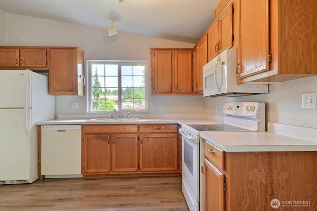 4018 144th Street Ct NW Unit 59, Gig Harbor, WA 98332 - kitchen with white appliances, lofted ceiling, light wood-style flooring, light countertops, and brown cabinets