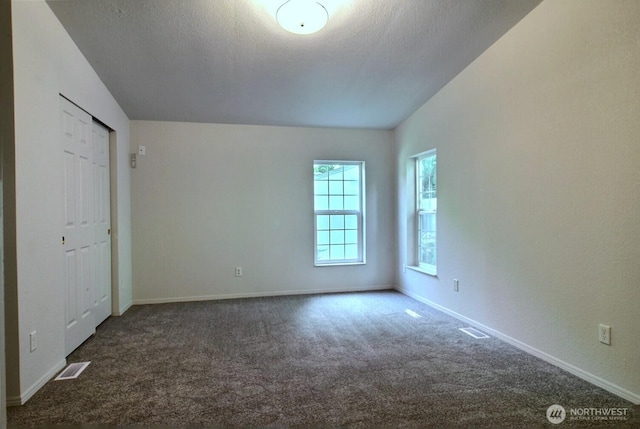 4018 144th Street Ct NW Unit 59, Gig Harbor, WA 98332 - unfurnished bedroom featuring carpet and a textured ceiling