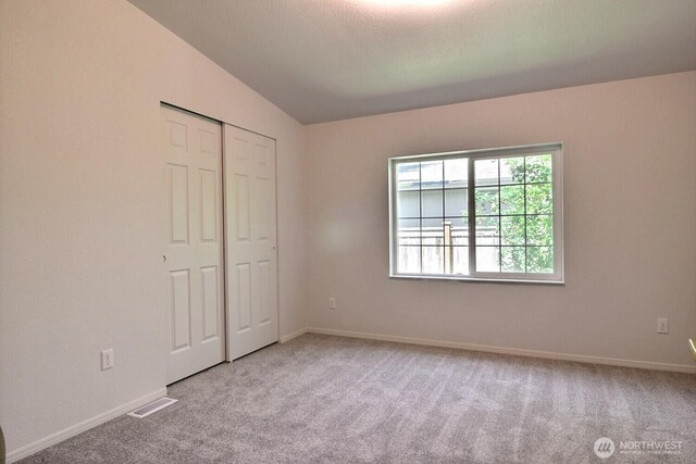 4018 144th Street Ct NW Unit 59, Gig Harbor, WA 98332 - unfurnished bedroom featuring carpet and a closet