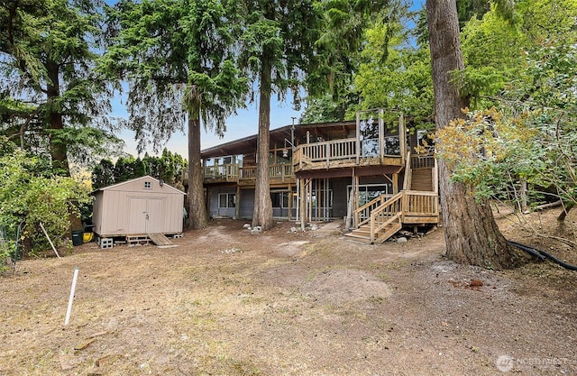 1711 E Lake Sammamish Pl SE, Sammamish, WA 98075 - rear view of house featuring a storage shed, a wooden deck, and stairway