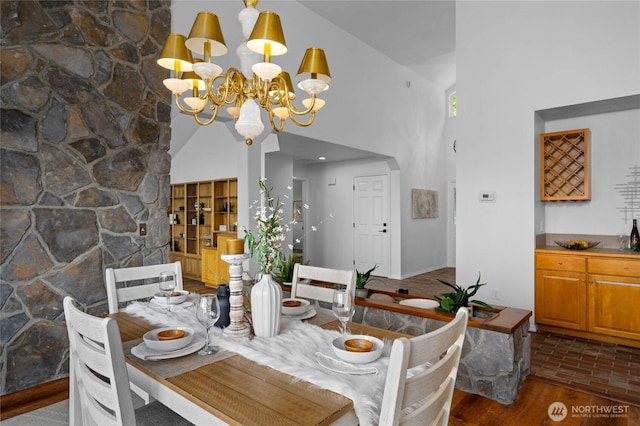 3995 Bay Ln, Anacortes, WA 98221 - dining room with a chandelier, high vaulted ceiling, and wood finished floors