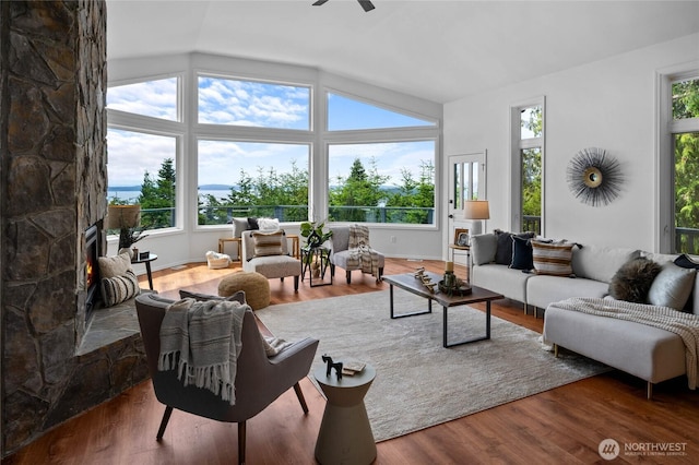 3995 Bay Ln, Anacortes, WA 98221 - living room featuring vaulted ceiling, healthy amount of natural light, wood finished floors, and ceiling fan