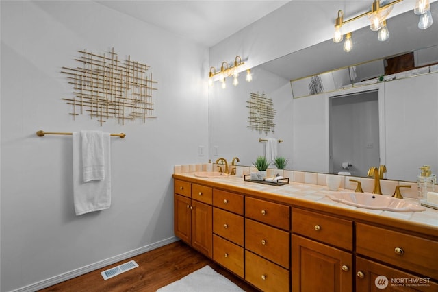 3995 Bay Ln, Anacortes, WA 98221 - full bathroom featuring double vanity and wood finished floors