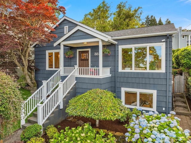 3833 24th Ave W, Seattle, WA 98199 - bungalow featuring stairs and roof with shingles