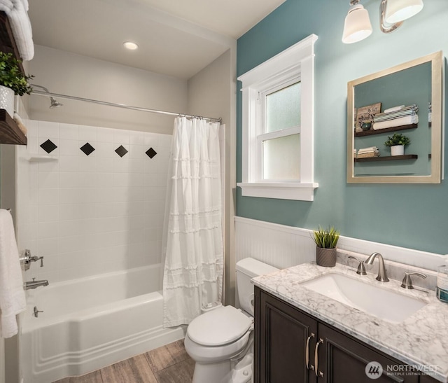 3833 24th Ave W, Seattle, WA 98199 - full bath featuring vanity, wood finished floors, shower / tub combo, and a wainscoted wall