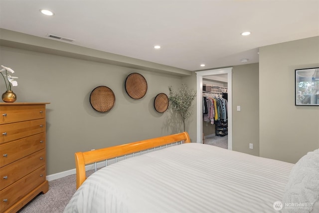 3833 24th Ave W, Seattle, WA 98199 - bedroom with light carpet, a spacious closet, recessed lighting, and a closet