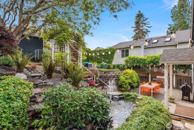 3833 24th Ave W, Seattle, WA 98199 - view of yard with a patio and a garden pond