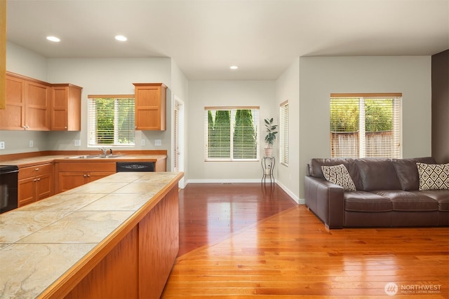 3610 147th Pl SE, Mill Creek, WA 98012 - kitchen with open floor plan, light wood-style flooring, tile countertops, recessed lighting, and black dishwasher