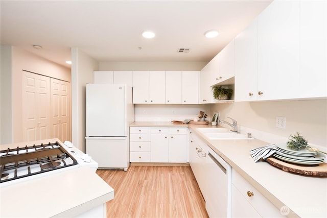 1318 37th St Unit 2-428, Everett, WA 98201 - kitchen with white appliances, light countertops, white cabinets, light wood-style flooring, and recessed lighting