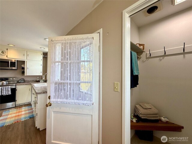 877 Mount Olympus Ave SE, Ocean Shores, WA 98569 - entryway with wood finished floors and recessed lighting