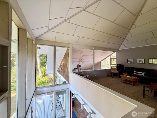 877 Mount Olympus Ave SE, Ocean Shores, WA 98569 - living room featuring lofted ceiling and carpet flooring
