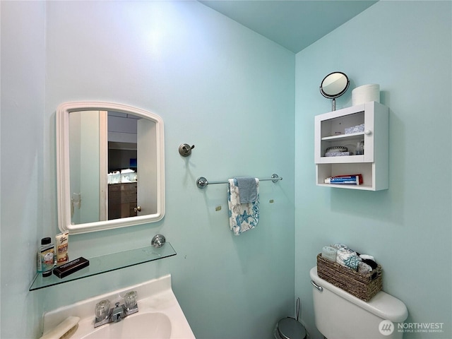 877 Mount Olympus Ave SE, Ocean Shores, WA 98569 - bathroom featuring toilet and a sink
