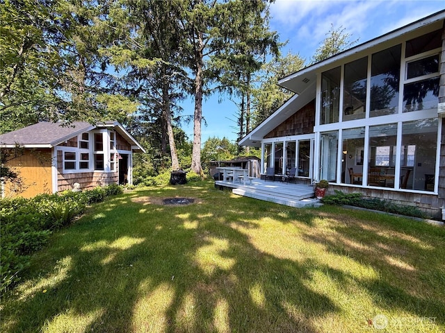 877 Mount Olympus Ave SE, Ocean Shores, WA 98569 - view of green lawn featuring a wooden deck